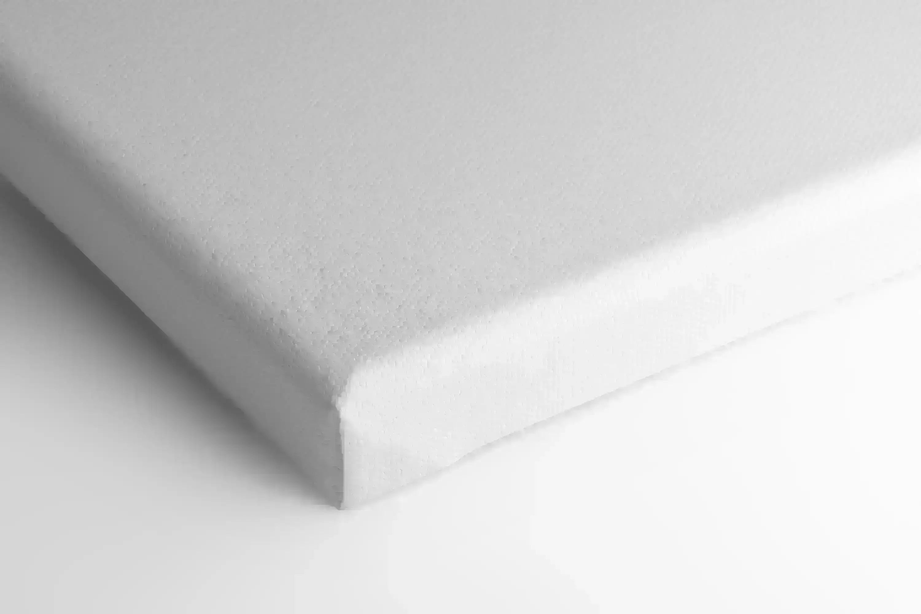 Closeup of matte canvas with visible texture and wrapped corner