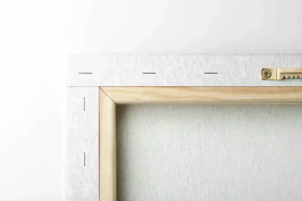 Closeup of matte canvas texture on wooden stretcher frame with hanging hardware