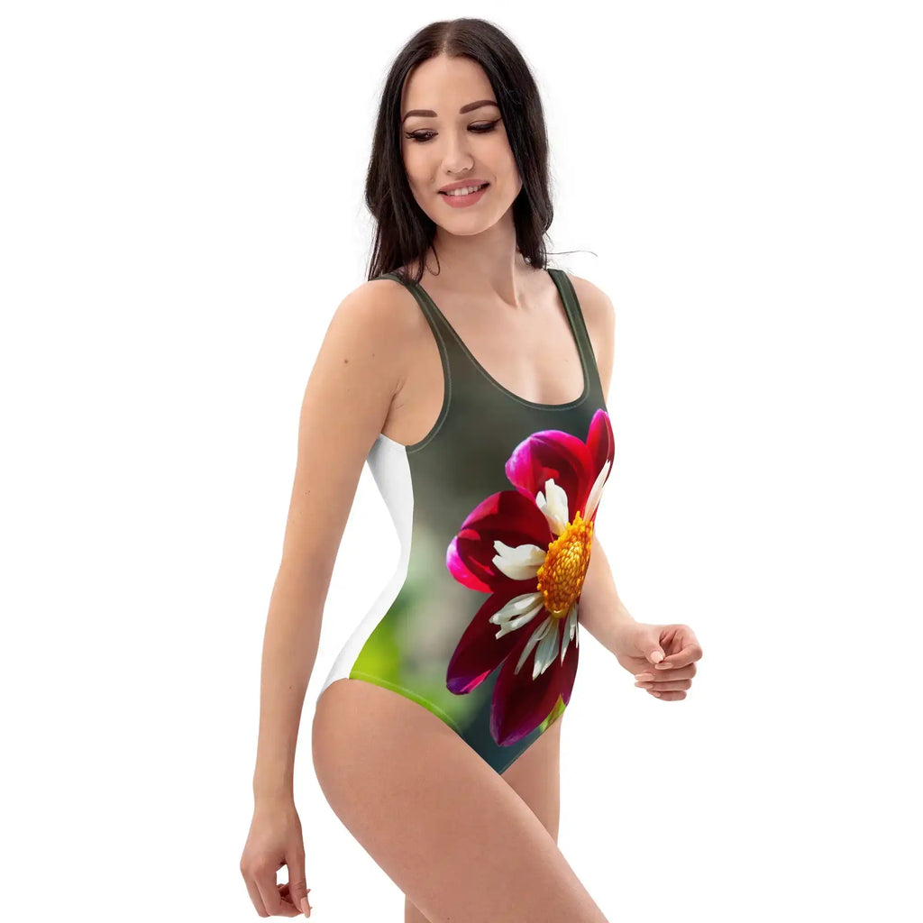 Woman wearing a swimsuit with a colorful flower design on a white background