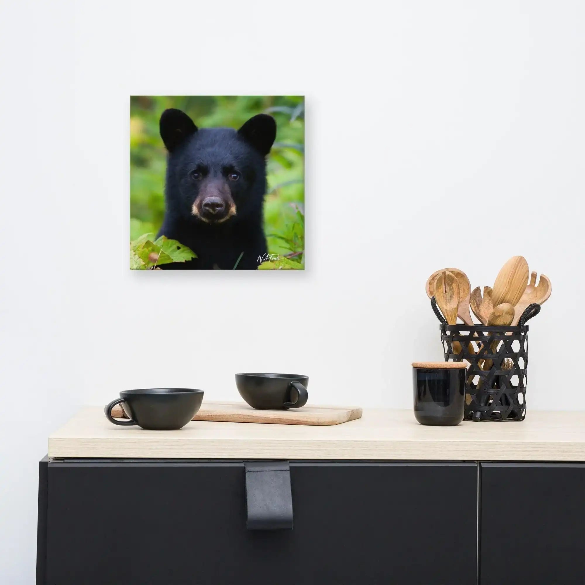 Adorable black bear cub exploring the forest, showcasing its playful and curious nature in a natural habitat