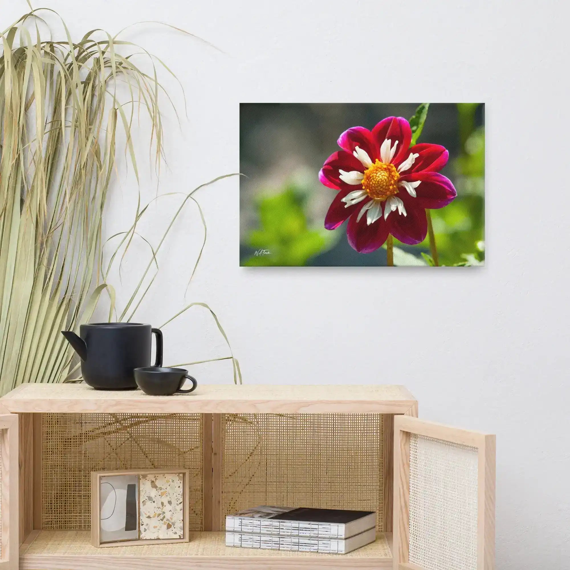 Modern living room decor with red and white flower canvas wall art, teapot, and houseplant