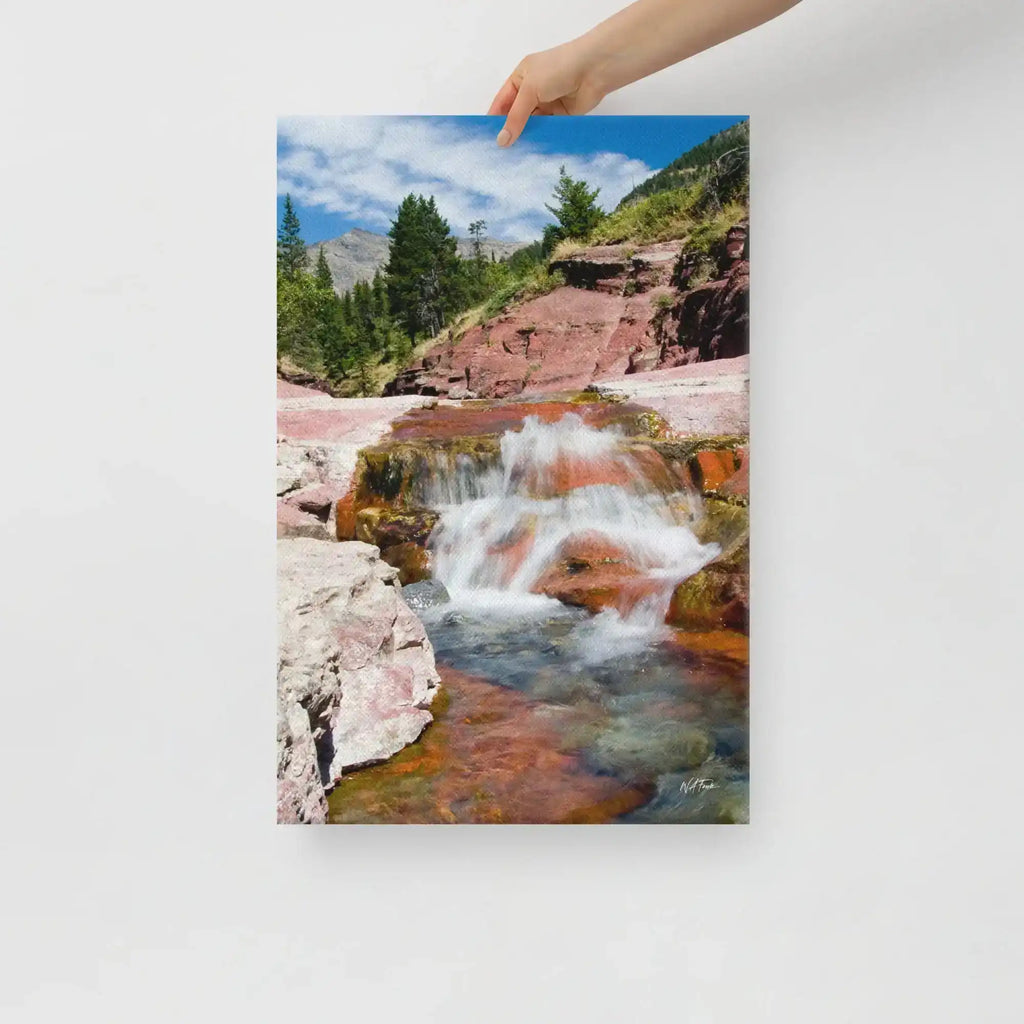 Hand holding canvas print of waterfall and rocky landscape, Bill's Photo Shop wall art