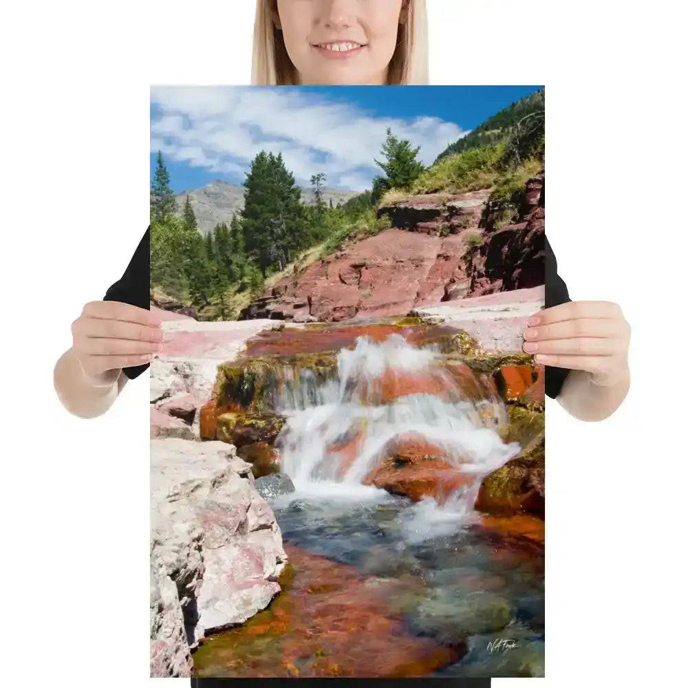 Woman holding canvas print of waterfall over red rocks, mountain landscape wall art