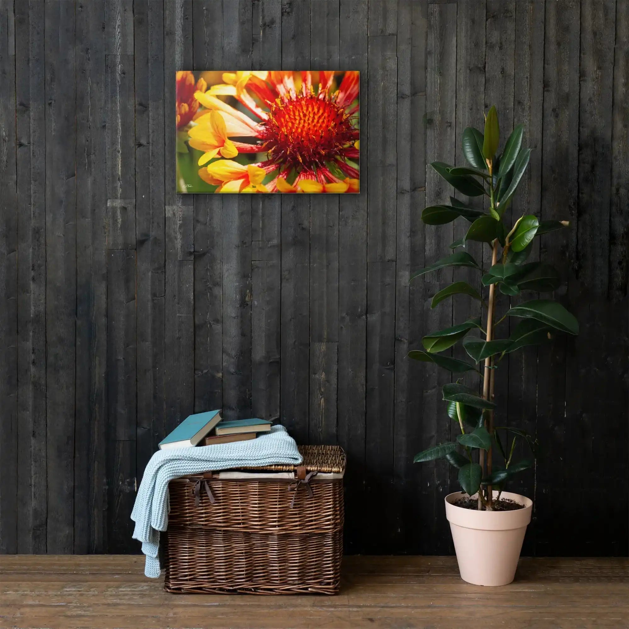 Colorful flower canvas wall art above wicker basket and potted plant in modern home decor