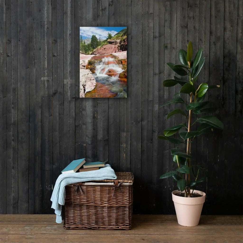 Framed waterfall landscape canvas on dark wood wall with plant and wicker basket, home decor