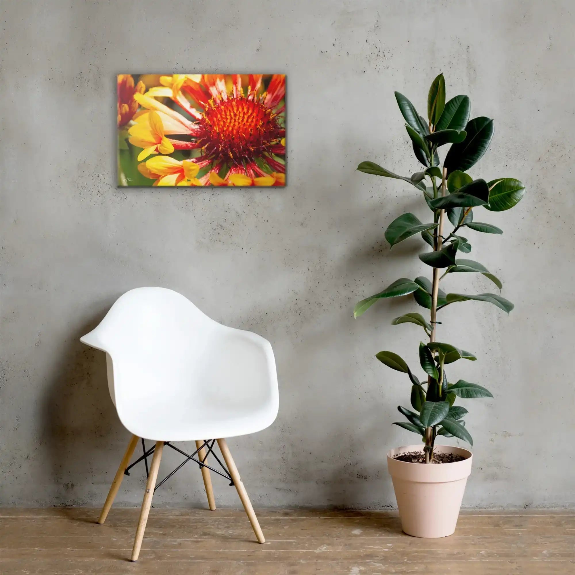 Floral canvas wall art with vibrant orange and yellow flower in modern minimalist room