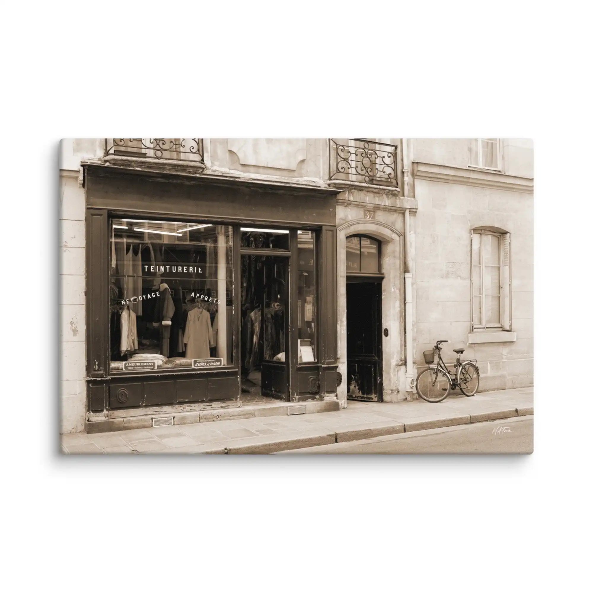Vintage-style photograph of a store front with a bicycle on a white brick wall background
