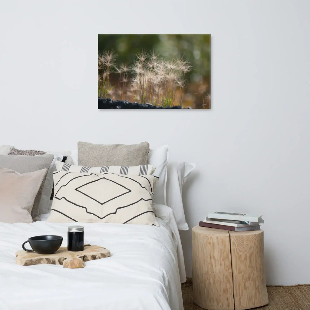 Nature photography canvas wall art with soft wildflowers above a modern bed in a cozy bedroom