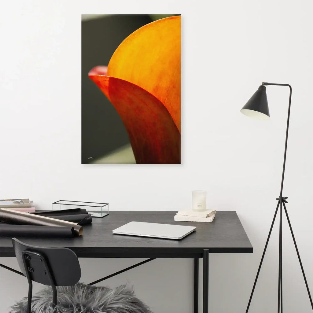 A vertical fine art macro photograph of a Calla Lily petal in shades of vibrant orange and gold. The sunlight filters through the petal, highlighting fine veins and textures against a soft, dark background. The image is presented as a professional gallery-wrapped canvas by Bill Fowle.