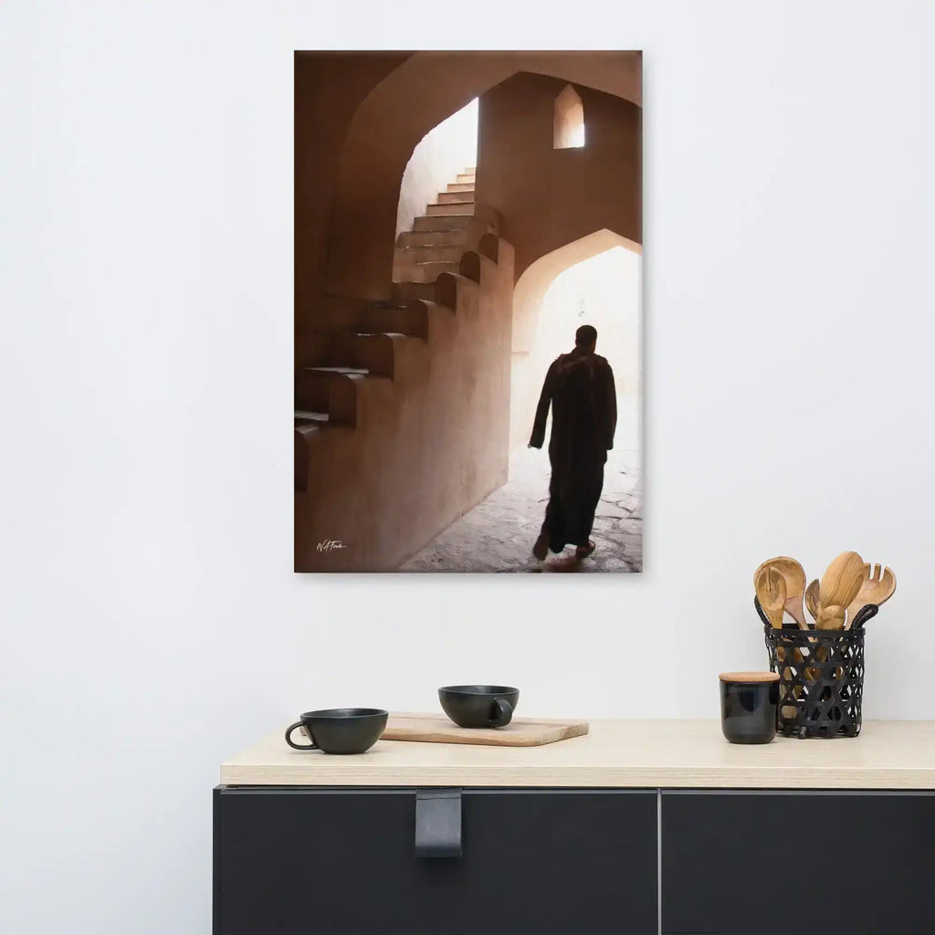 Canvas wall art featuring a silhouette walking through an arched stone hallway with stairs