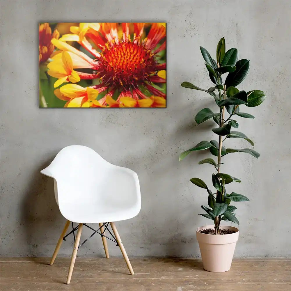 Bright flower canvas wall art hangs above a modern chair and potted plant in a minimalist room