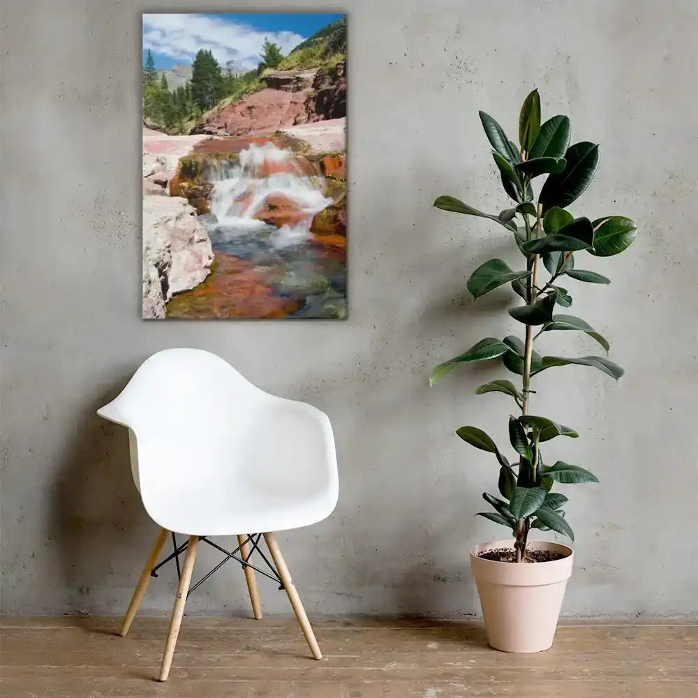 Modern room with white chair, potted plant, and waterfall landscape canvas wall art