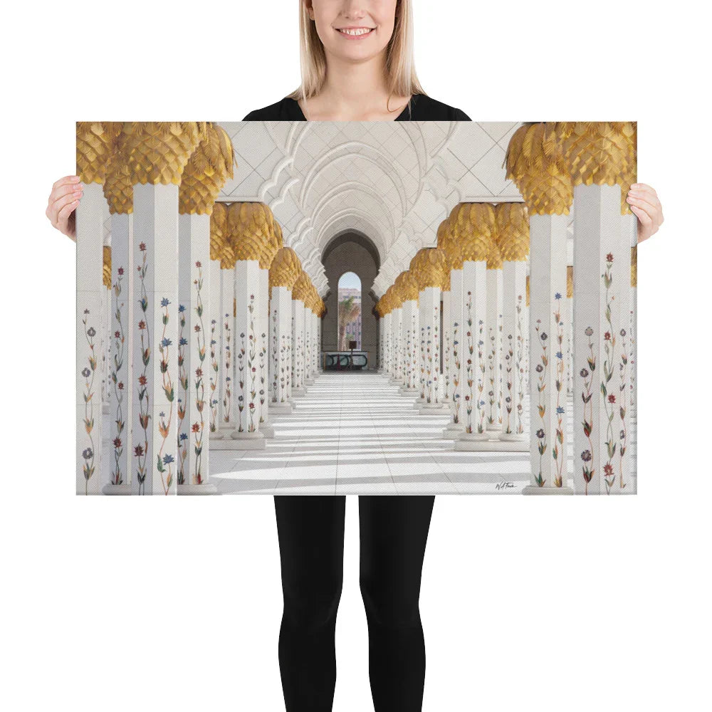 Woman holding a canvas print of ornate white columns with gold accents, Bill's Photo Shop wall art