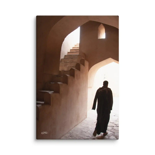 Person walking through a sunlit archway with steps in a warm-toned setting