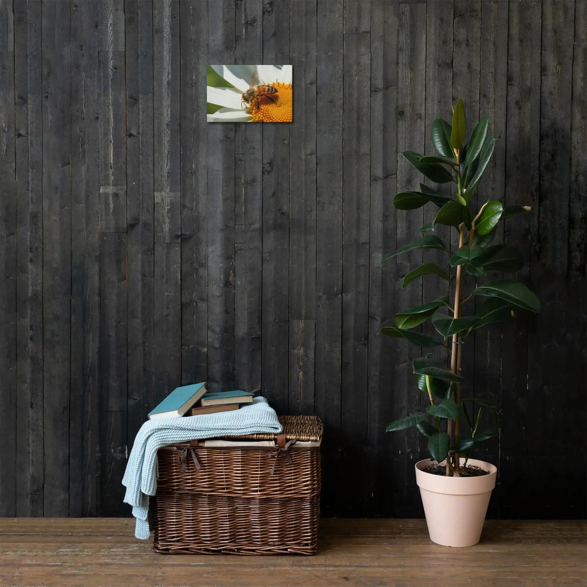 Bee on flower canvas wall art in cozy living room with plant and wicker basket