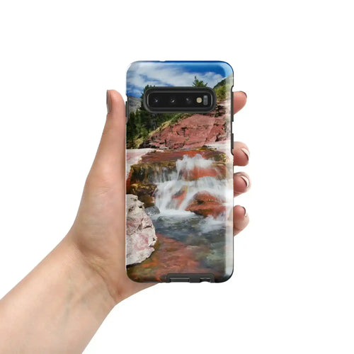 Hand holding Samsung Galaxy S10 case with glossy waterfall and red rock landscape photo print