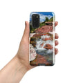 Hand holding Samsung Galaxy S20 case with glossy waterfall and red rock landscape design