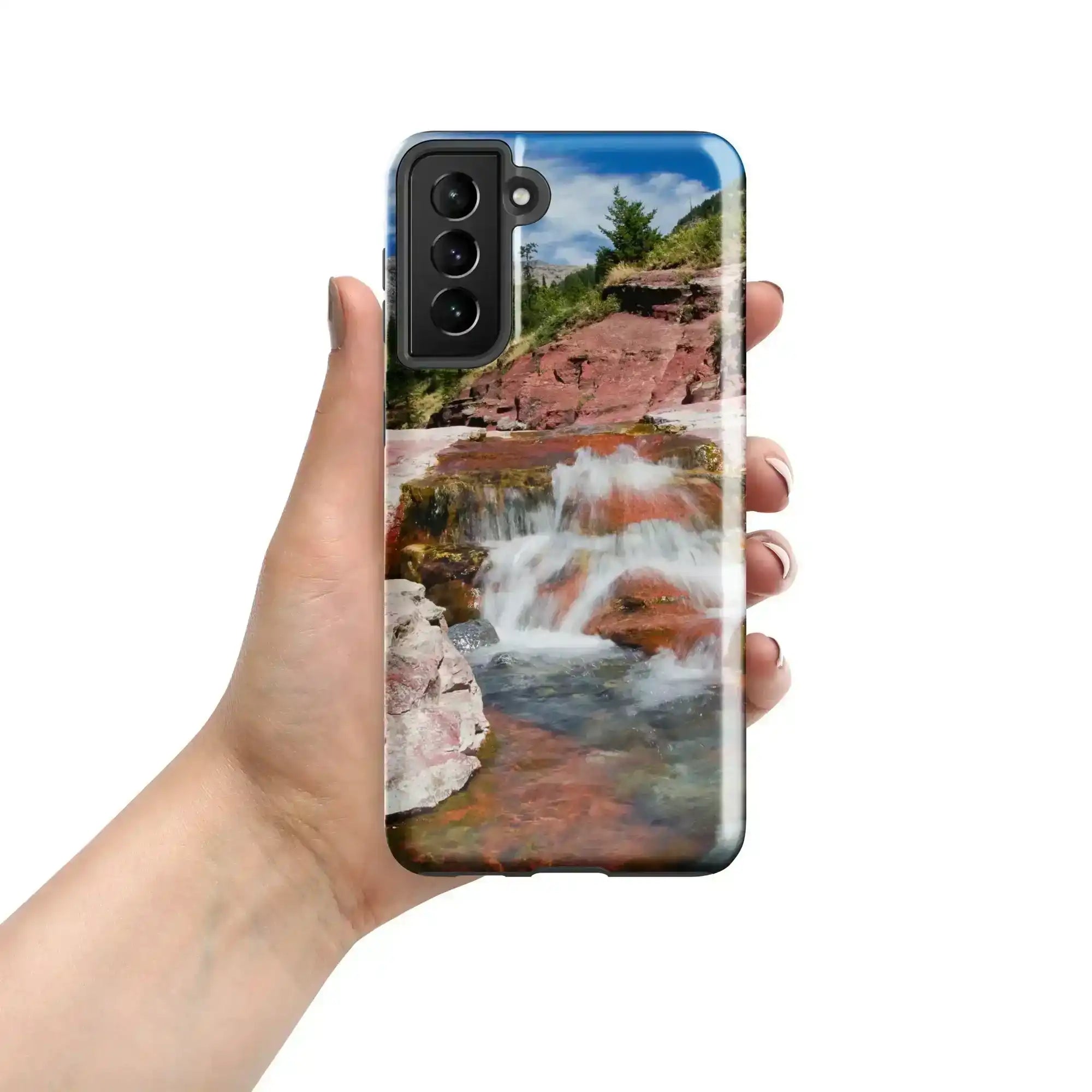 Hand holding Samsung Galaxy S21 Plus case with waterfall and nature photography design