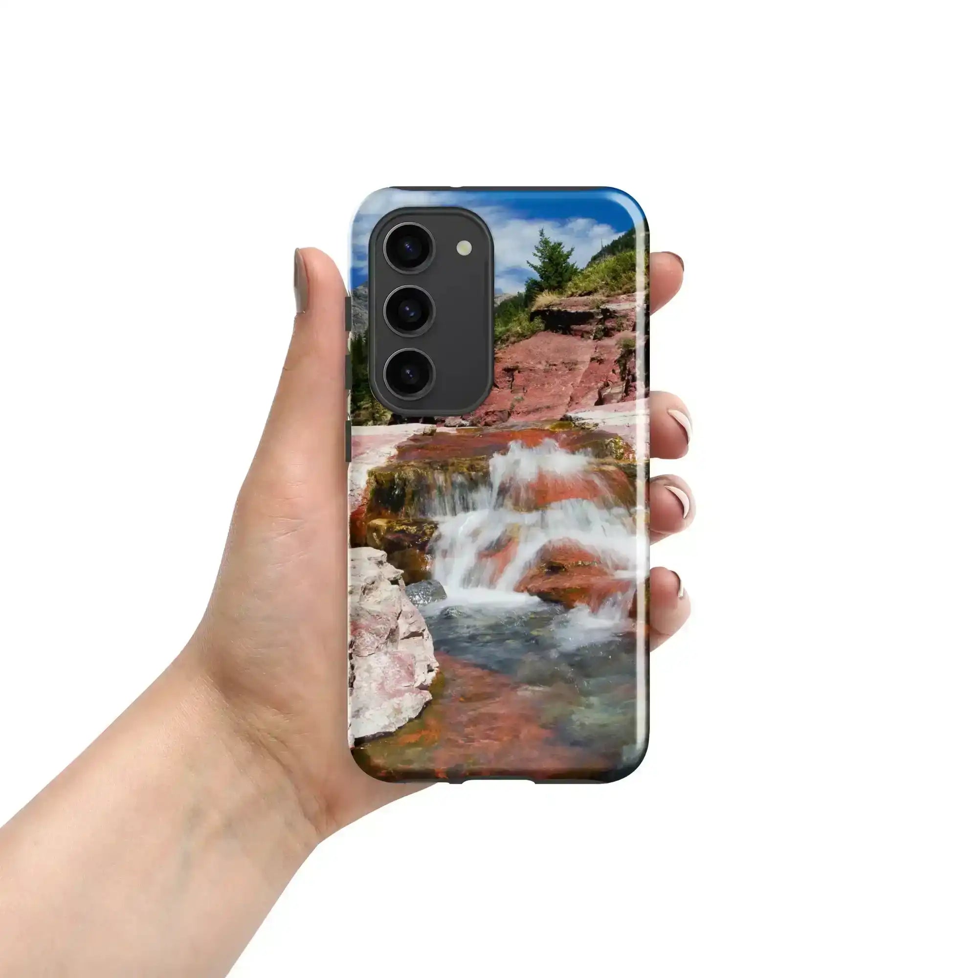 Hand holding Samsung Galaxy S23 case with waterfall landscape photo design