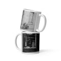 Two mugs stacked on top of each other with black and white images on a white background