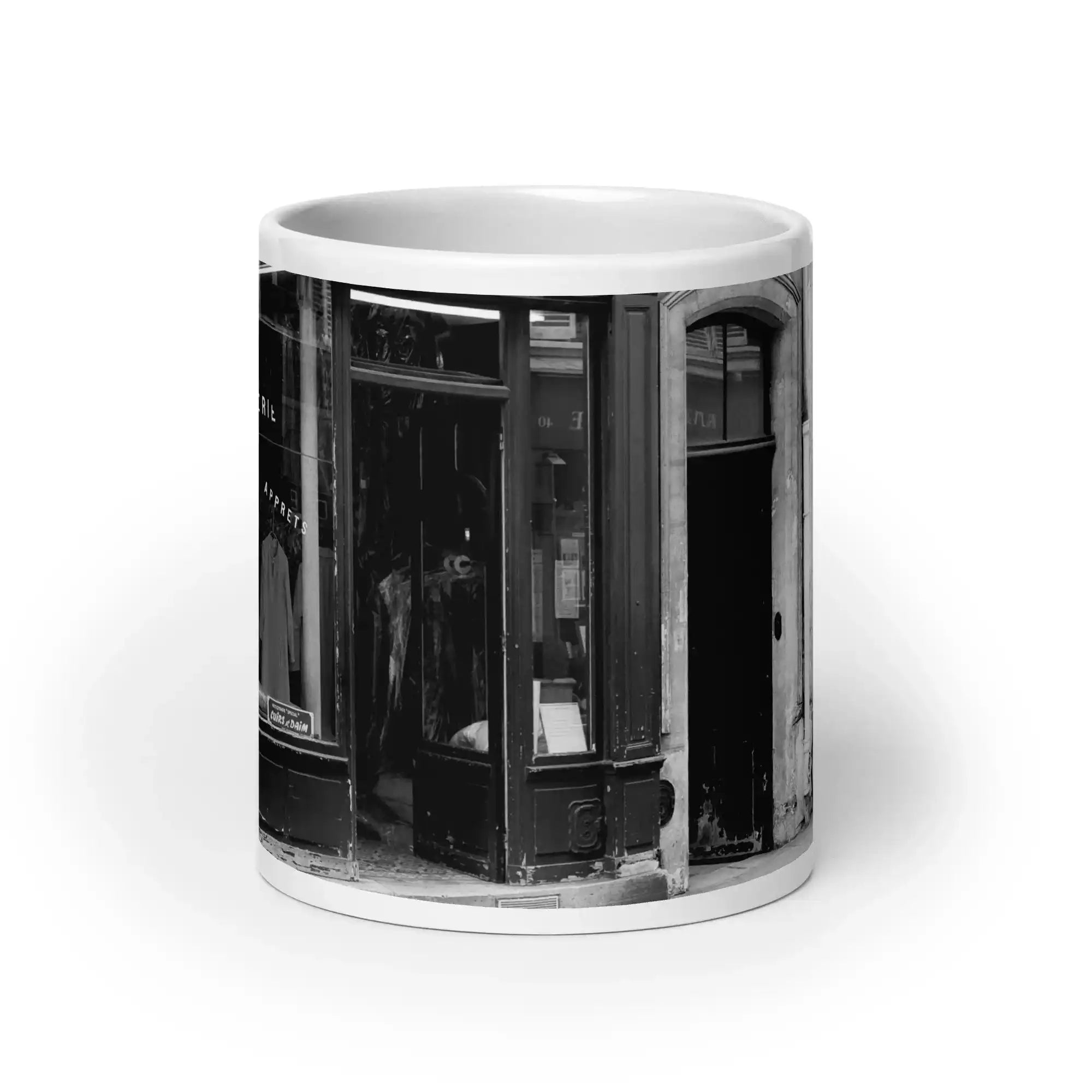 White glossy mug with black and white vintage storefront photo print, front view